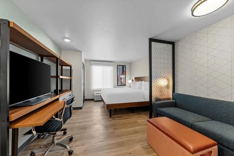 Settle into a spacious studio with bed, sofa, and desk.