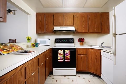 Prepare meals with ample counter space and classic cabinetry.