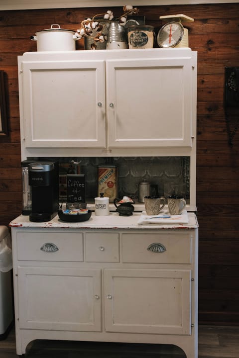 Authentic, vintage Hoosier cabinet with flour sifter serves as coffee/tea bar