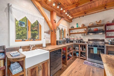 Equipped with a dishwasher and gas range, making meal prep a breeze in the kitchen of the cottage. 