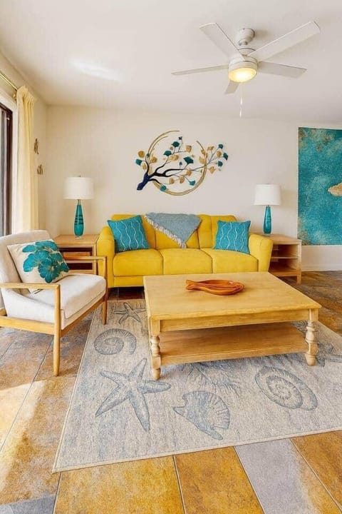 Bright coastal sofa with plush pillows, perfect for lounging after a beach day