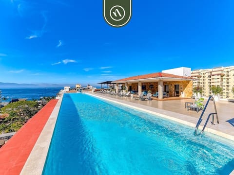 Dive into pure relaxation! Our spectacular rooftop infinity pool offers sweeping panoramic views of the ocean and the beautiful Puerto Vallarta coastline.
