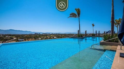 Experience resort-style living with a stunning infinity pool, panoramic mountain views, elegant lounge areas, and premium amenities designed for comfort, relaxation, and luxury.