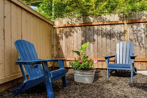 seating area in fully fenced yard