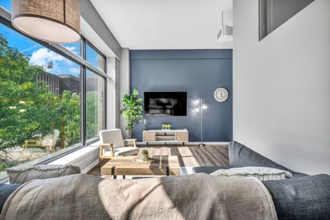 Relax in the lofted living room with a full-size sectional sleeper sofa, perfect for unwinding after a busy day.
