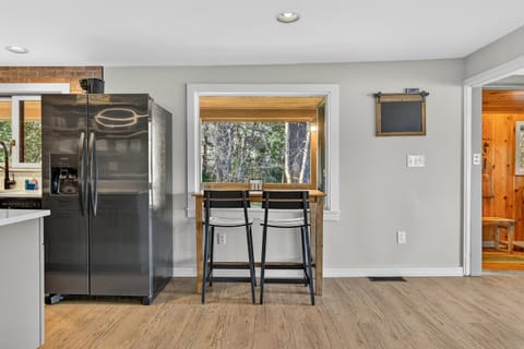 Bar seating and kitchen pass-through for casual meals.