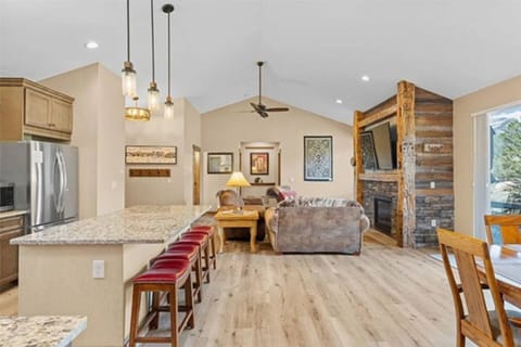 Unwind beneath timber beams in this elegant living area—complete with plush seating, elevated décor, and open mountain vibes
