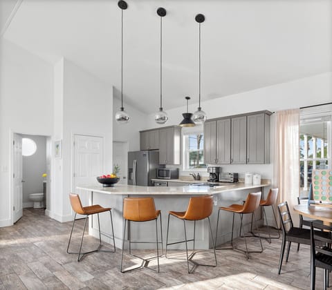 Furnished with stools for flexible seating. (Tidal Wave)