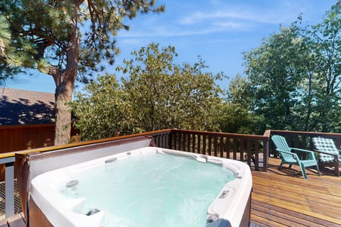 Soak, relax, and spread out. This home features a private hot tub and a huge back patio, ideal for morning coffee, evening sunsets, and starry-night soaks.