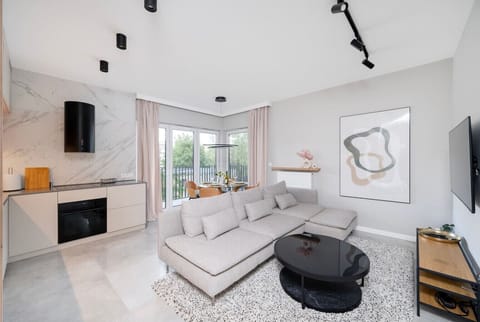 Stylish Living Room with Sofa Bed and Smart TV | Book Now with RENTUJEMY