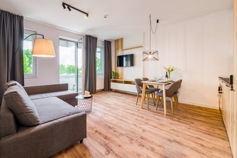 Living Room with Sofa Bed, Smart TV and Dining Table | Book Now with RENTUJEMY.COM