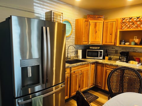 Full fridge with a freezer drawer and ice dispenser