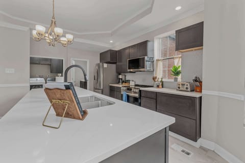 Welcome to your culinary playground! This stylish kitchen is perfect for whipping up gourmet meals or hosting unforgettable dinner parties.