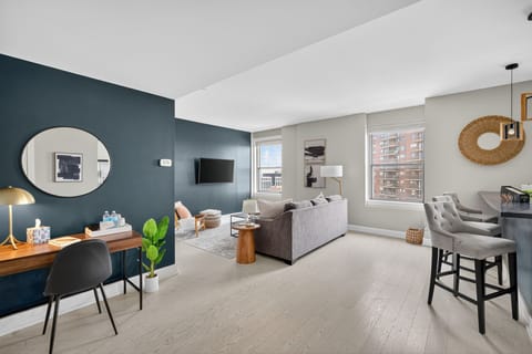 Wake up to city views in this bright, open-concept living space with a thoughtfully arranged sofa bed.