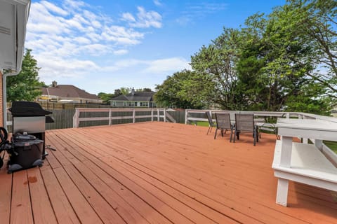 Step outside to a private deck designed for comfort, connection, and outdoor dining.