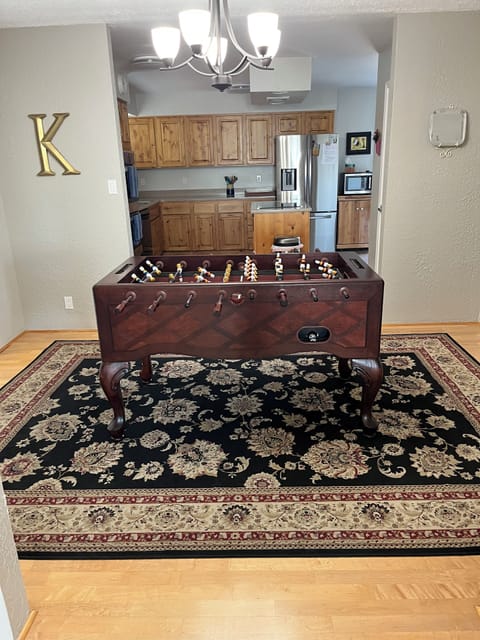 Fusball table in separate room next to pool table