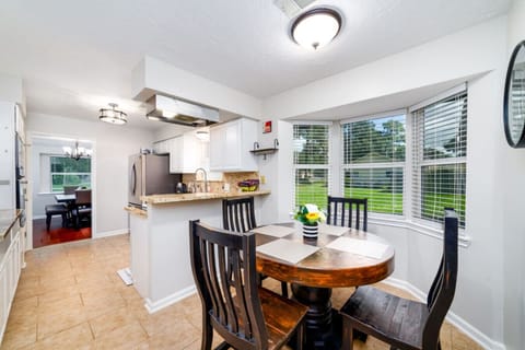 Sunny dining corner overlooking the backyard — perfect for casual meals and relaxed mornings.