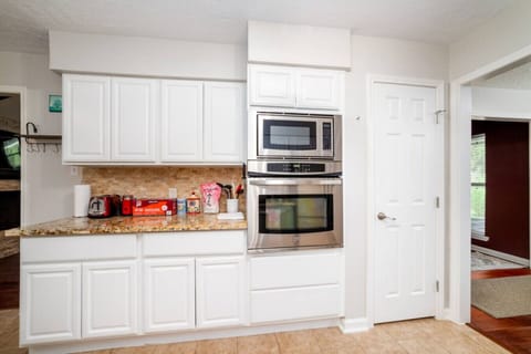 Contemporary kitchen setup with sleek appliances and ample storage — perfect for extended stays.