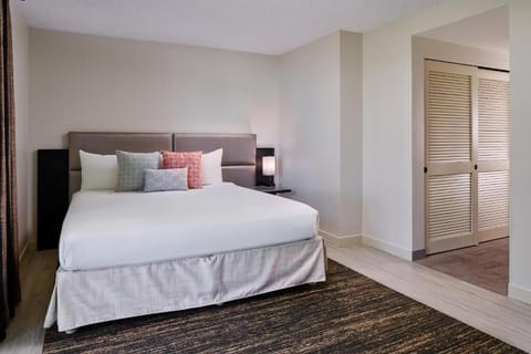 Recharge in a serene bed with crisp, inviting linens.