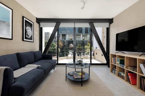 Living room with tv and balcony