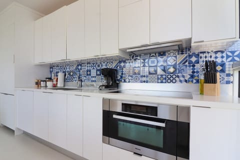 Experience gourmet living at the beautifully-designed kitchen of 250 Collins