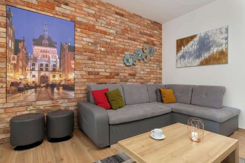 Relax in the stylish living room with a comfortable sofa and modern decor.