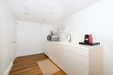 Kitchen with Two Burners, Pots, Pans, and everything you need to make a meal.