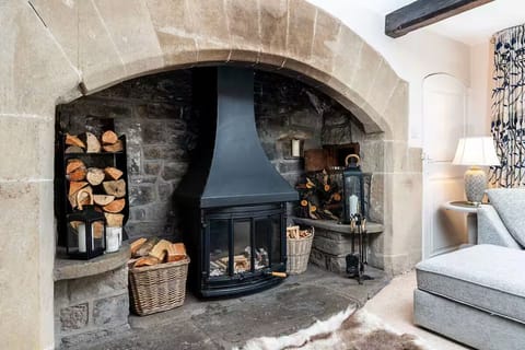 Original inglenook fireplace dating back to late 1600 in the living room.