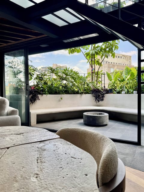 Dining with terrace doors open, indoor/outdoor space. Constant hummingbirds