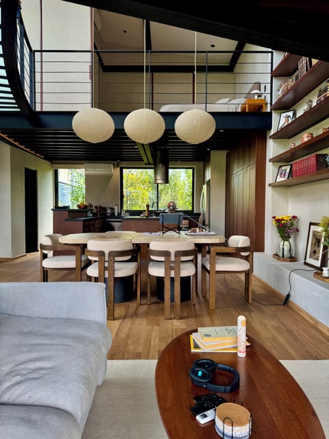 Dining w/ above BR doors open.  Custom steel and marble table, walnut chairs