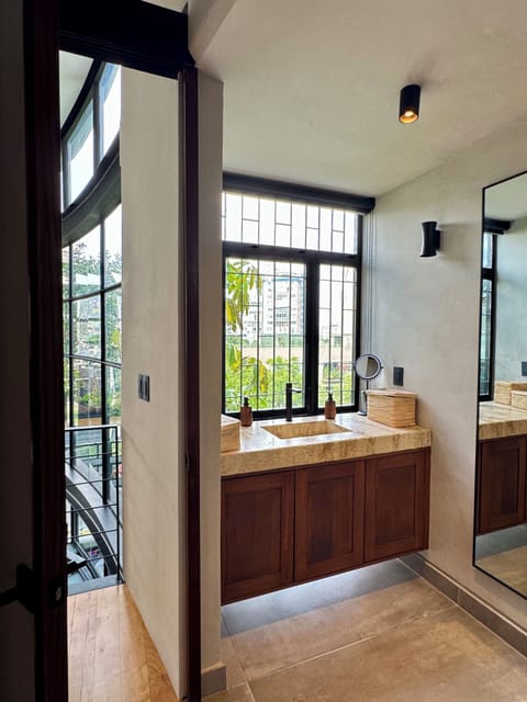 Master bath with city and garden views