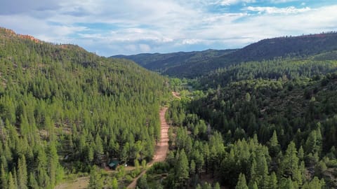 Get away from it all—this cabin retreat sits in a hidden valley surrounded by scenic trails.