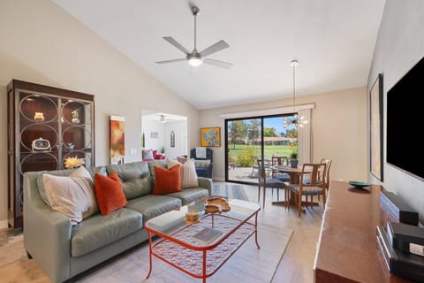 Open Living Room With Ceiling Fan And Plenty Of Lighting
