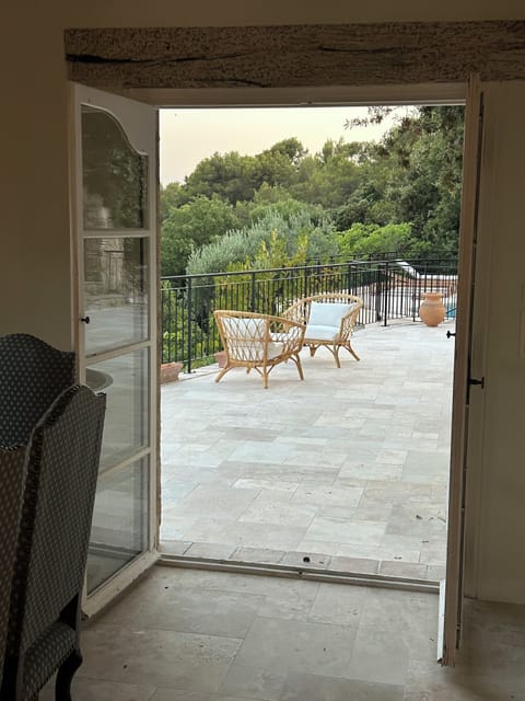 Main living space inside & terrace outside & pool all on same level with railing