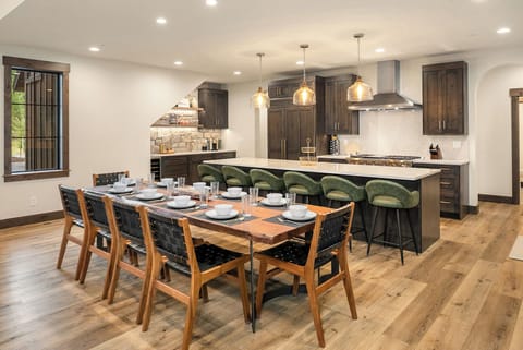 1 More Pool Day. - Comfortable seating for up to 8 at the dining table with additional seating for 6 at the kitchen island.