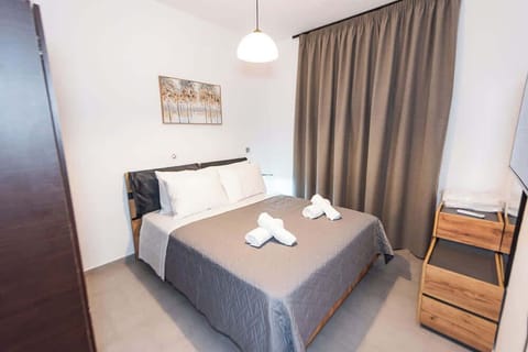 Bedroom with Wardrobe, TV, and Pool View


