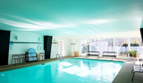 Dive into a sunlit indoor pool for year-round bliss.