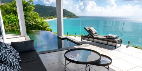 Settle into cushioned seating and savor the private sea panorama.