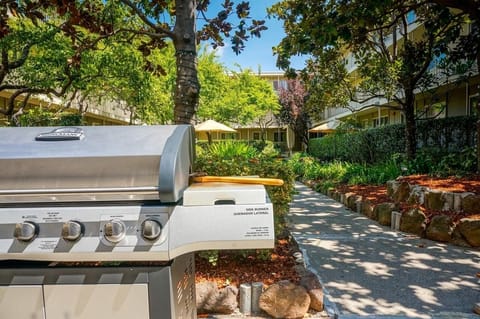 Gather for sunny cookouts on the shared garden grill.