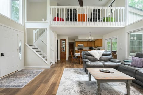 Spacious open-concept living area with cozy seating and natural light