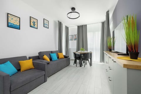 Relax in the stylish living room with a comfortable sofa and modern decor.