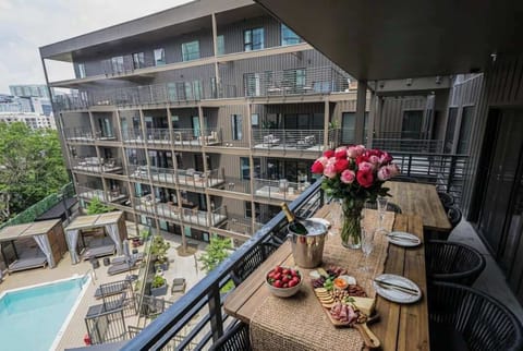 This unit overlooks the building's courtyard and pool. Enjoy breakfast, dinner or drinks on the spacious  private balcony. 
