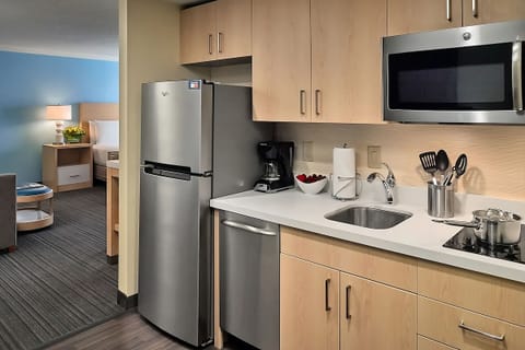 Cook quick meals with full-size fridge, sink, and essentials