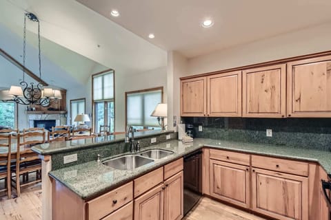 Fully equipped kitchen with counter seating for 3