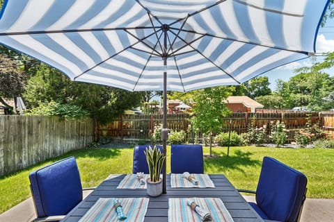 Gather with family and friends in the beautiful rose-lined fully fenced backyard