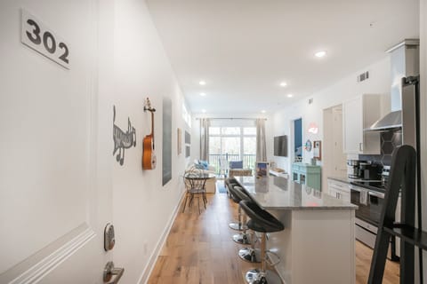 The view from the entry way. Kitchen, Living space and balcony