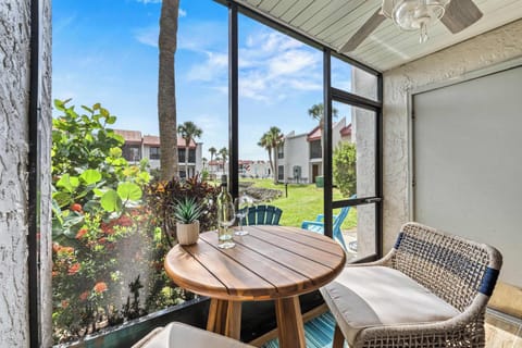 Gather ’Round – Screened-in patio retreat at Runaway Bay with lagoon views, steps from the pool, private beach access, and the lively community hub The Patio. Perfect for relaxation and socializing on Anna Maria Island.
