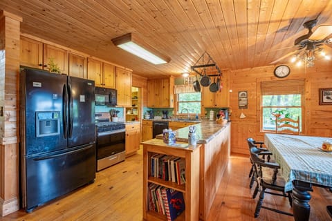 With modern appliances, ample prep space, and dining right beside it, this kitchen is designed to make group meals easy during your Smoky Mountain getaway.