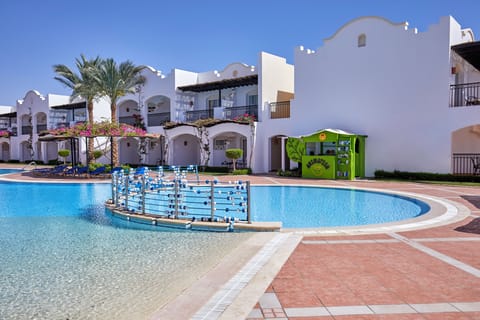 Lounge beside the calm, shallow pool with sunny views.