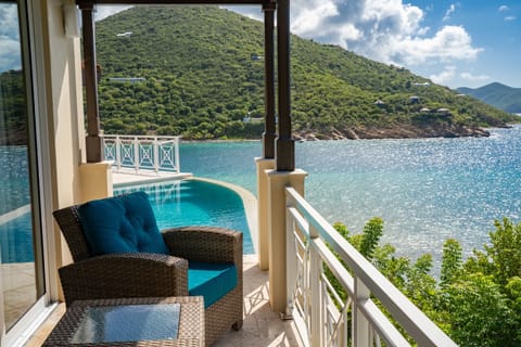 Dive into your infinity-edge escape overlooking turquoise bay.